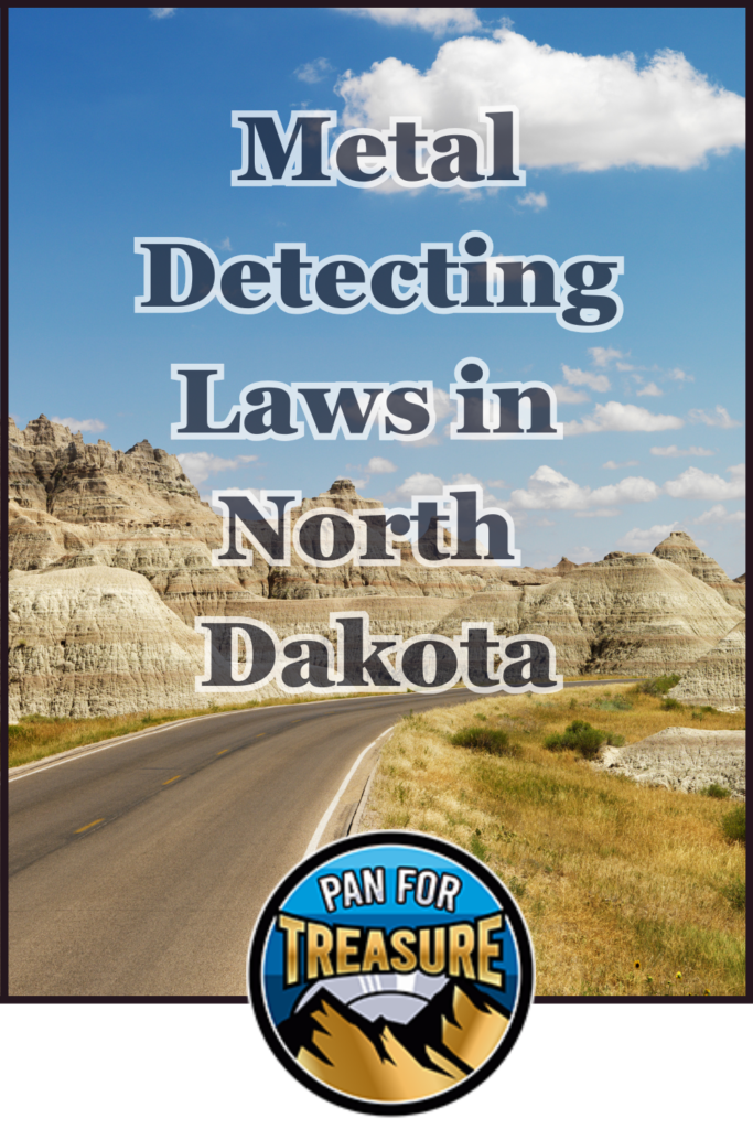 A paved road winds through rocky, grassy hills under a blue sky with clouds. Text reads: "Metal Detecting Laws in North Dakota." Stay informed about metal detecting rules in North Dakota. The "Pan for Treasure" logo appears at the bottom.
